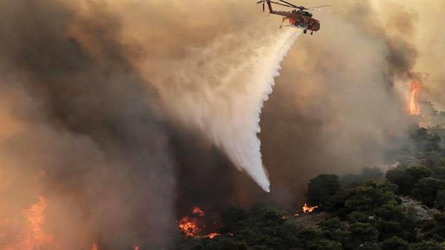 Στης Ελλάδας την ολόμαυρη ράχη...